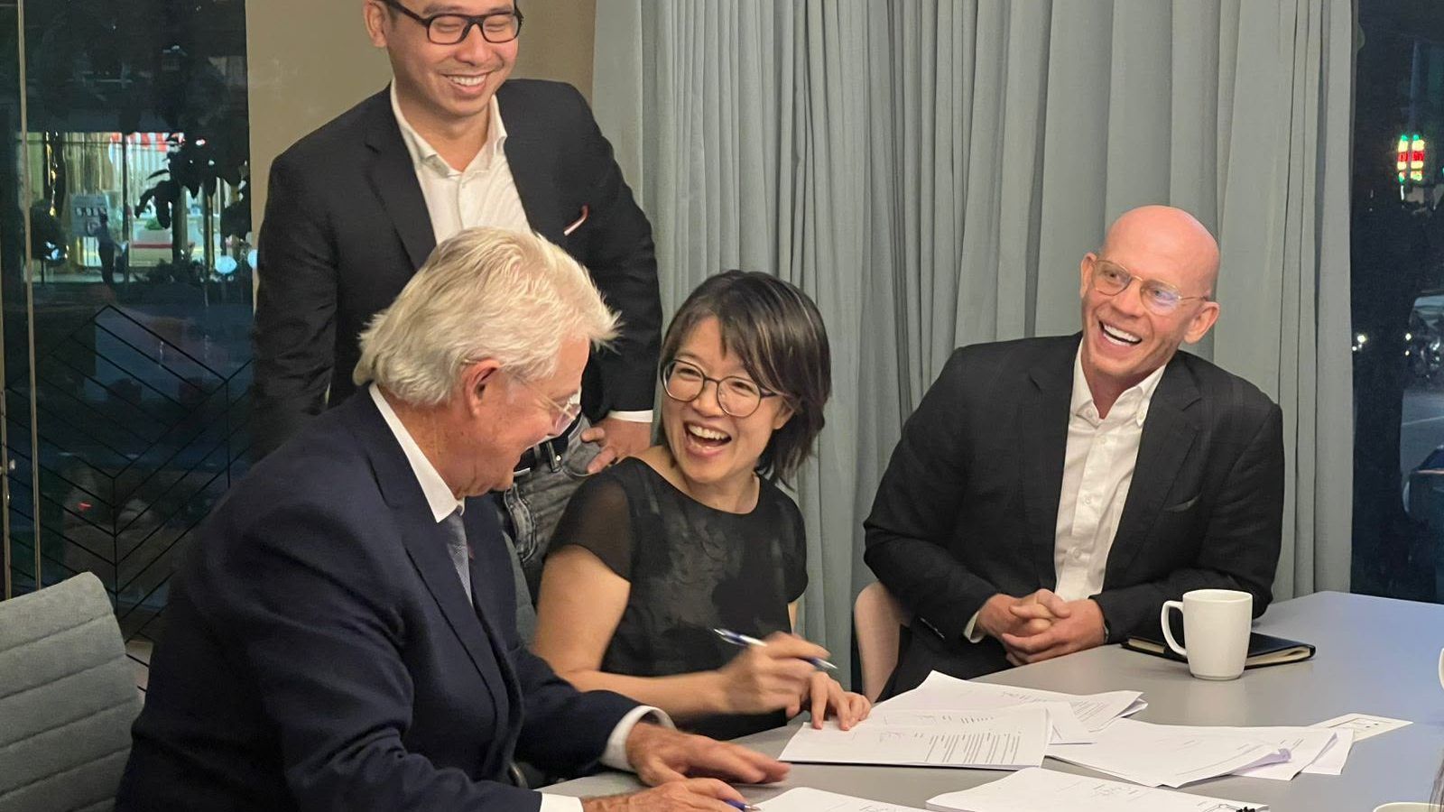 Joshua James and colleagues at the signing of a school acquisition agreement in Vietnam