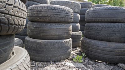 Old used car tires stacked in piles — Mayfield, KY — Hawkins Of Mayfield Inc Old used car tires stacked in piles — Mayfield, KY — Hawkins Of Mayfield Inc