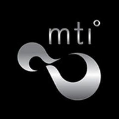 Black logo with silver abstract swirl and small “mti” text on a black background Black logo with silver abstract swirl and small “mti” text on a black background