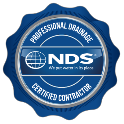 A blue seal that says professional drainage certified contractor