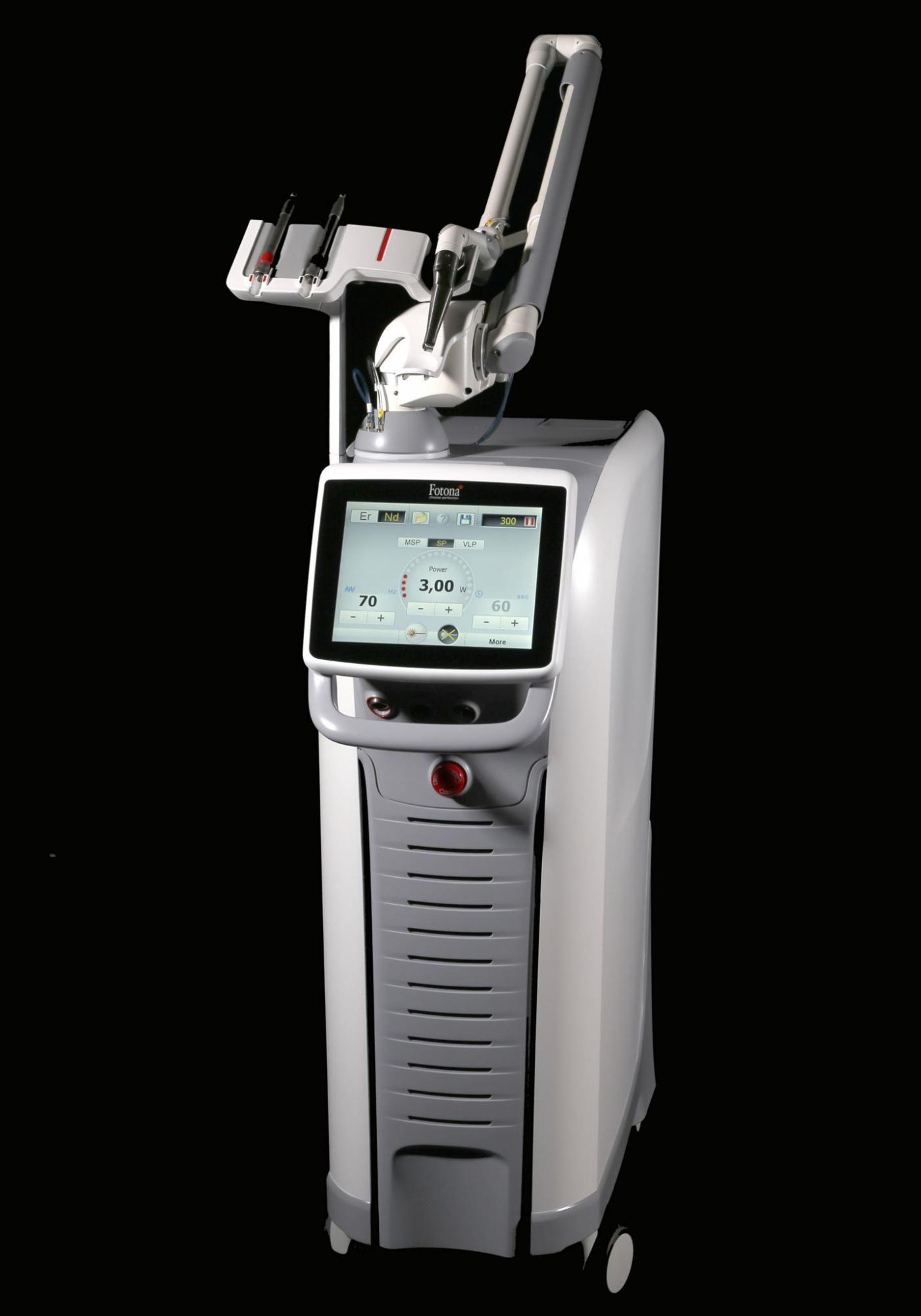 A white and gray machine with a screen on a black background.