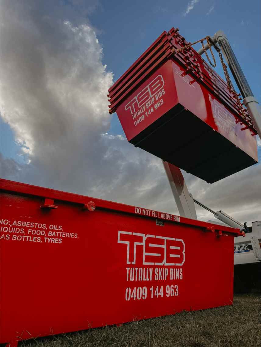 A Red Dumpster With the Word TSB on It — Totally Skip Bins in Yatala, QLD