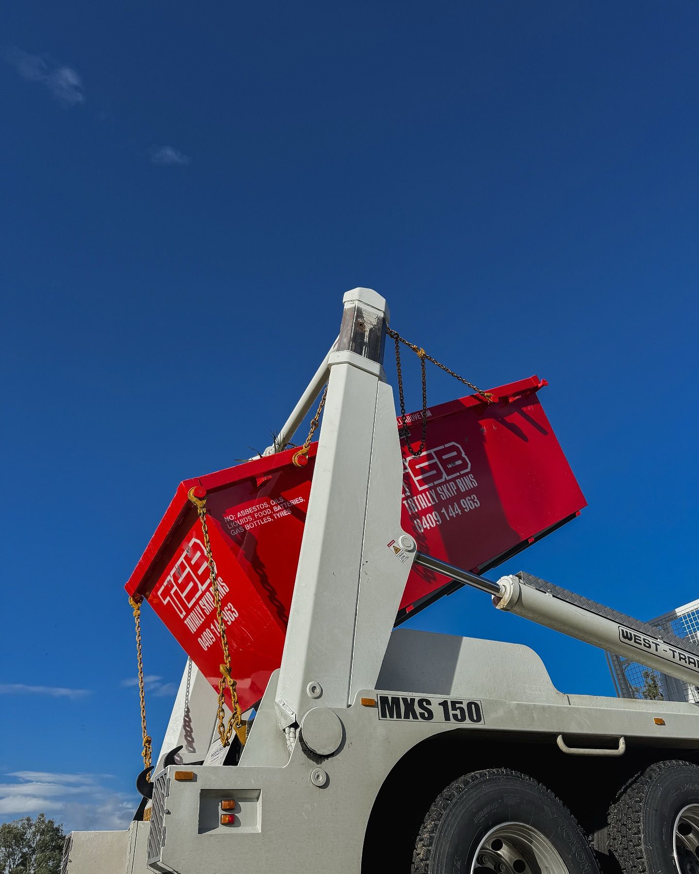 Skip Bin On A White Truck