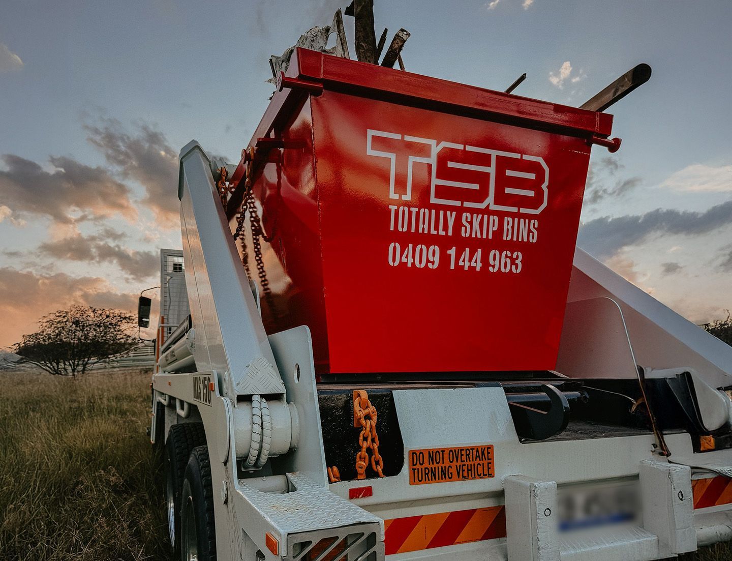 Red Skip Bins On Truck