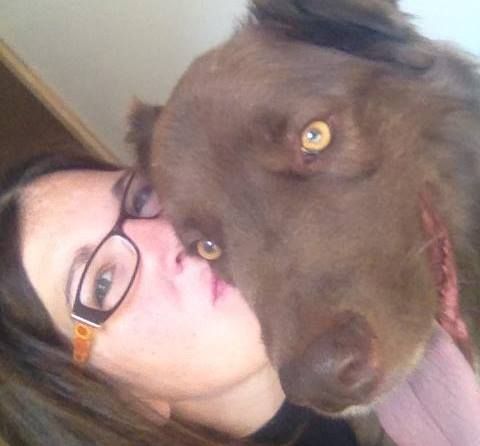 Smiling woman in a selfie with her dog