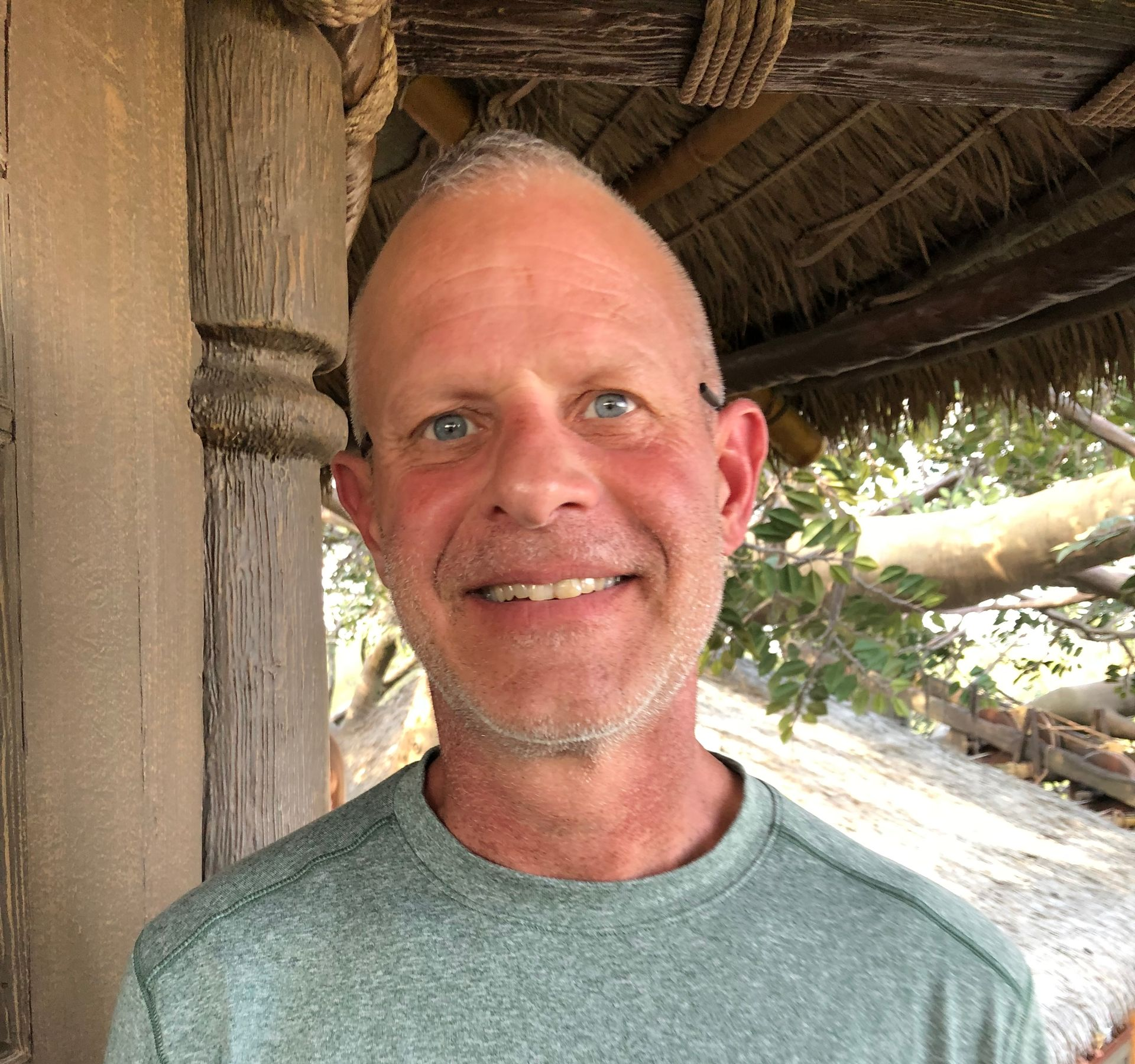 Smiling man on vacation - someplace tropical!