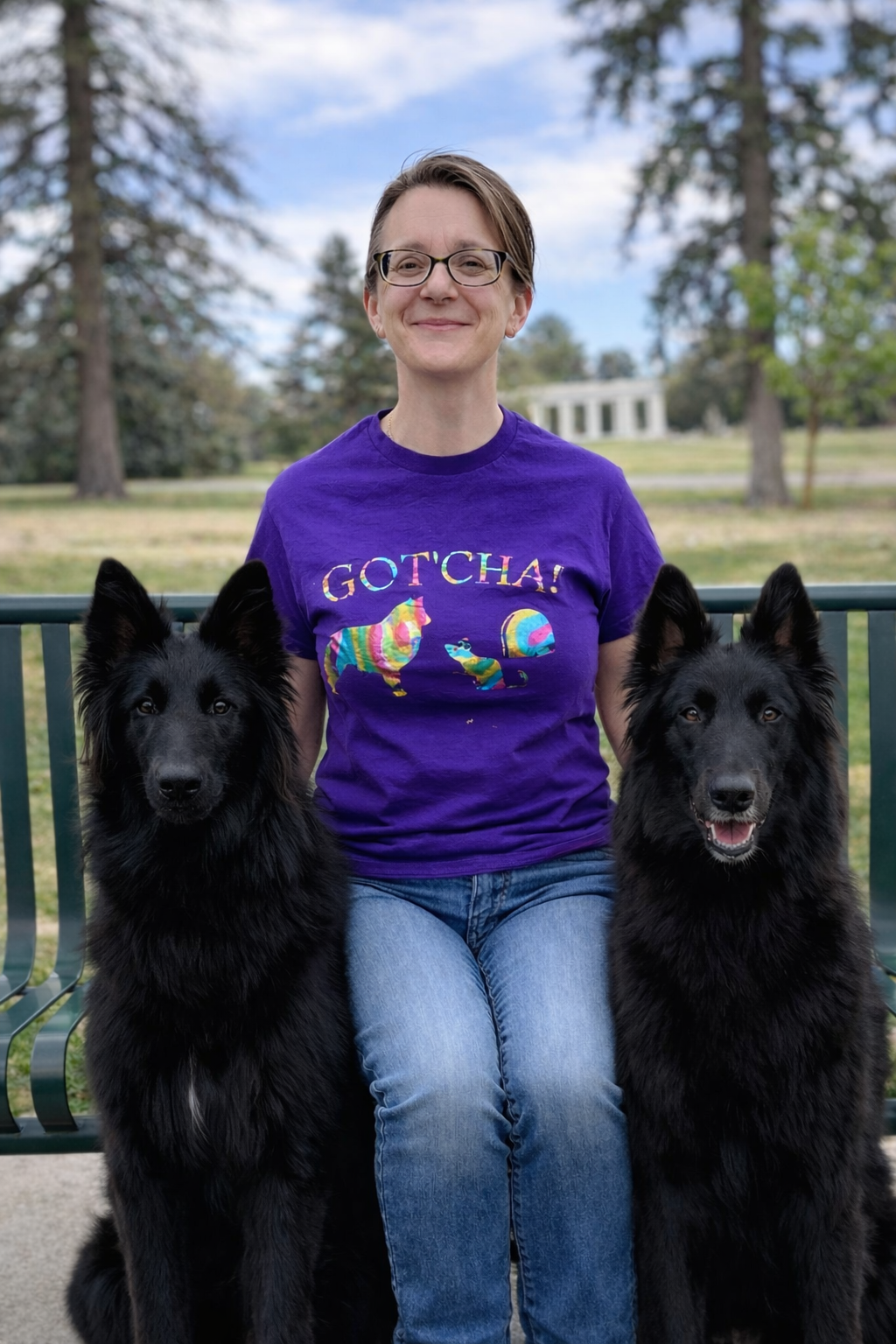 Happy woman with her Belgian Sheepdogs