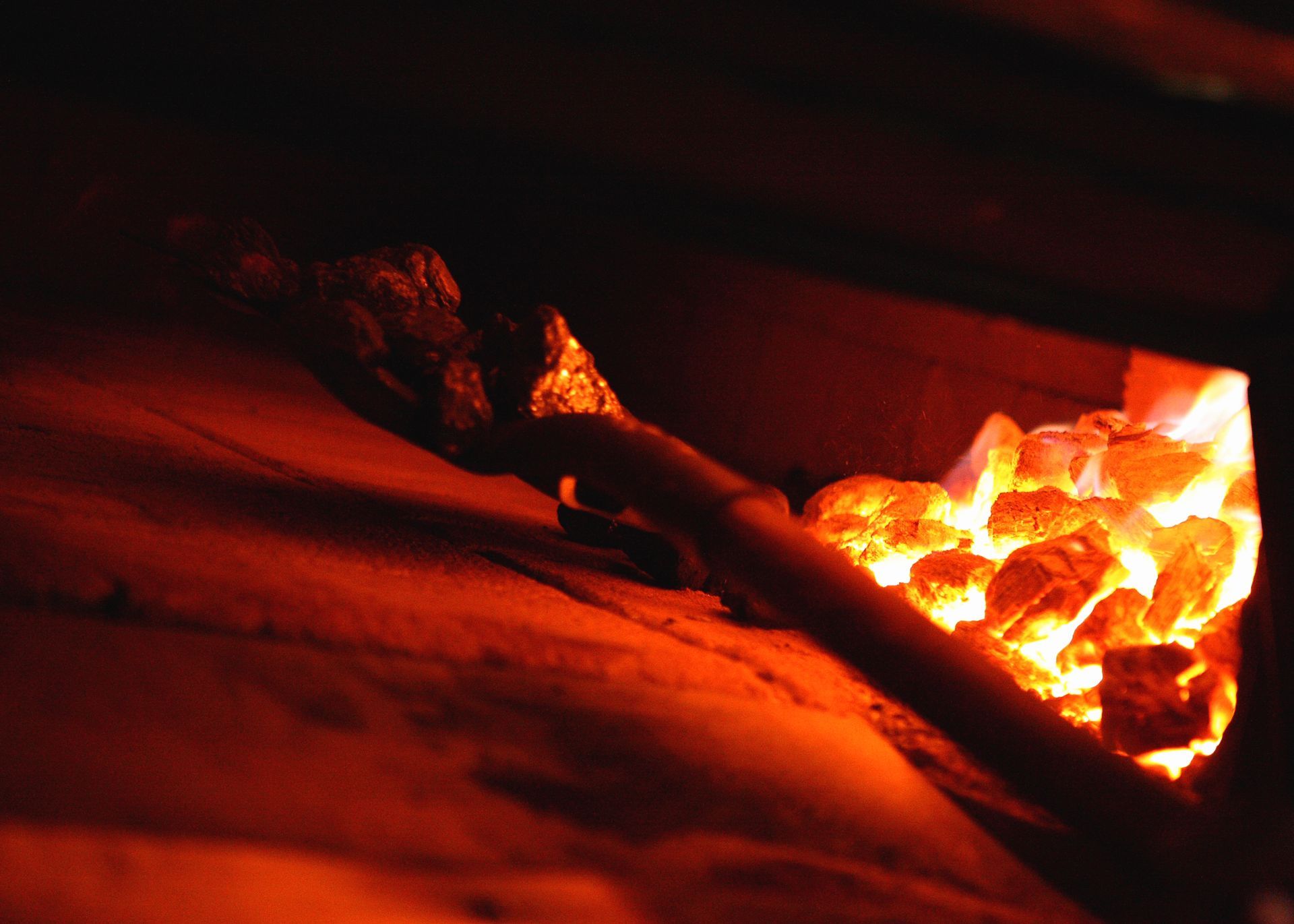 A close up of a fire in a brick oven