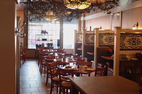 A restaurant with a lot of tables and chairs
