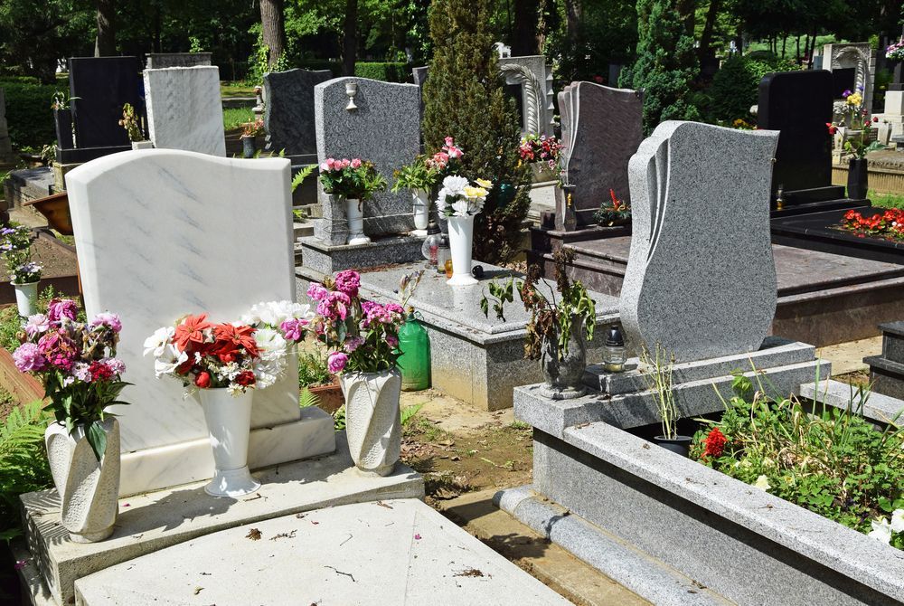 Graveyard With Several Headstones of Different Shapes and Colours — Mid Coast Monuments In Kempsey, NSW