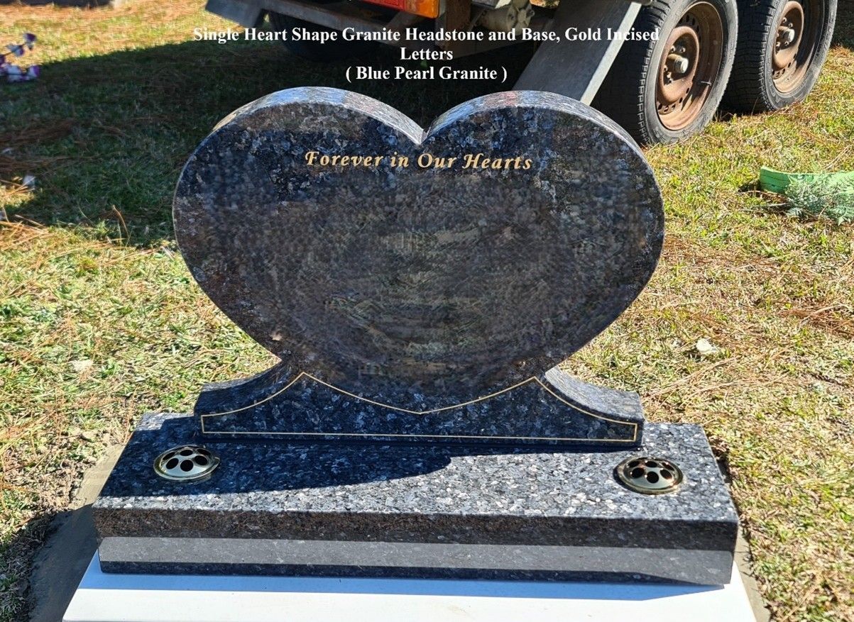 Heart-shaped headstone made of blue pearl granite with gold lettering and two flower vases — Mid Coast Monuments In Forster, NSW