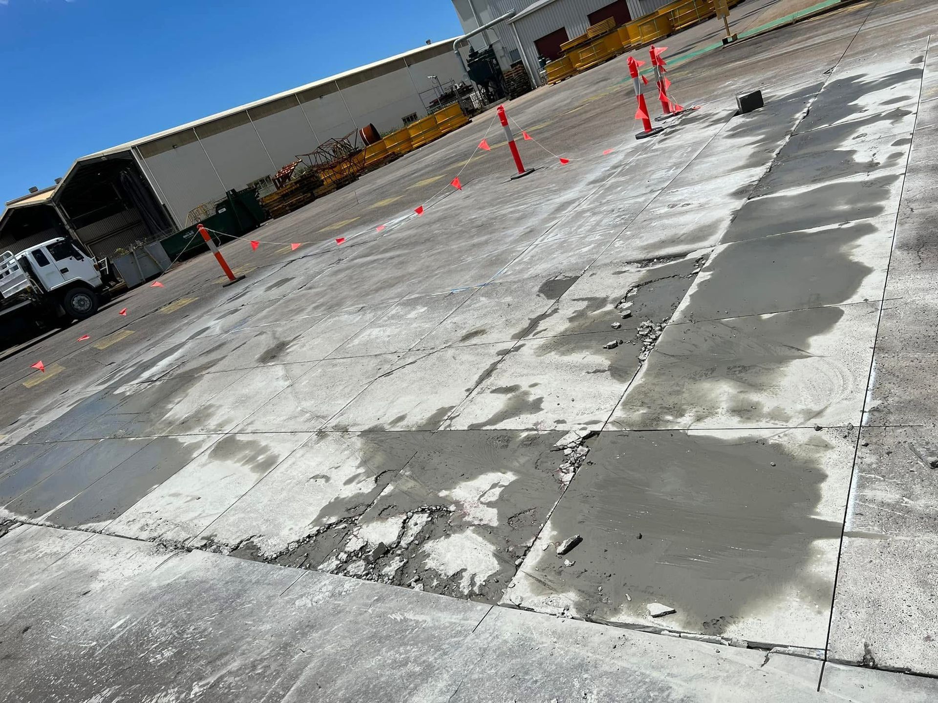 Concrete Repair Work on a Paved Area With Safety Cones — Ablecut Concrete Cutting & Coring In East Mackay, QLD