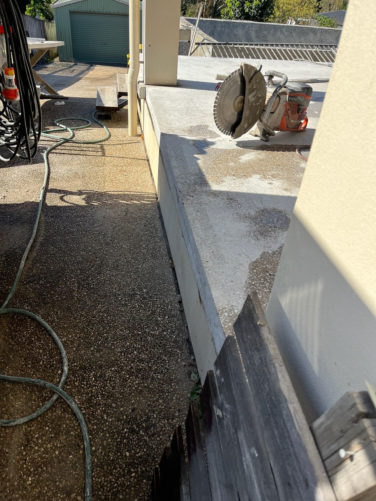 Concrete Saw Cutting a Concrete Surface on a Sunny Day — Ablecut Concrete Cutting & Coring In East Mackay, QLD