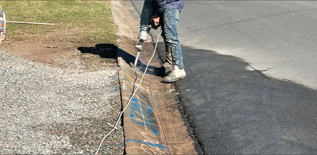 Orange Husqvarna Concrete Saw With a Black Blade Guard — Ablecut Concrete Cutting & Coring In East Mackay, QLD