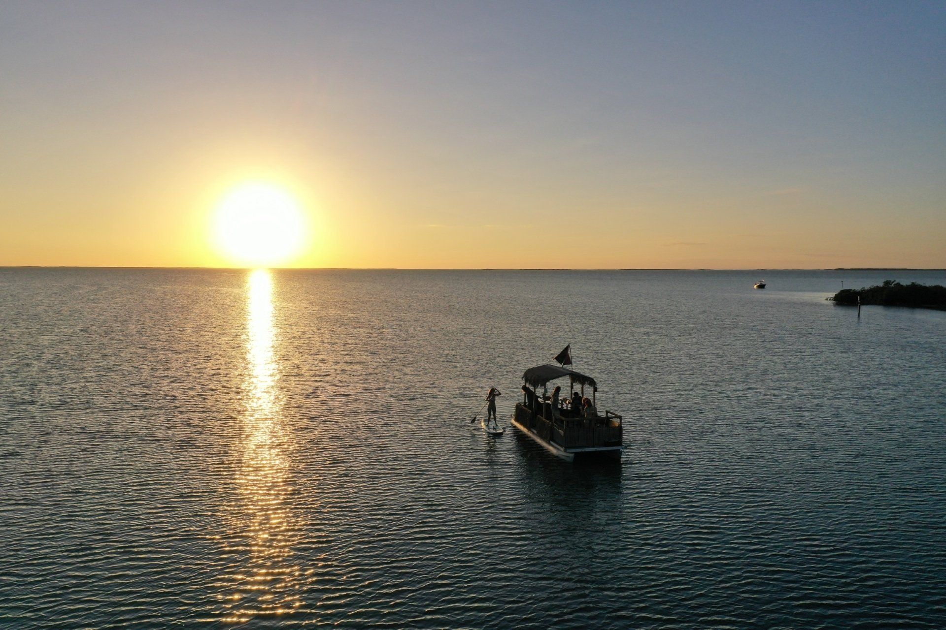 Boat travelling during a sunset