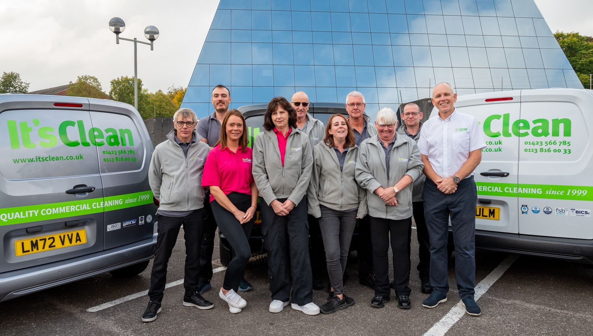 Commercial cleaning company team in uniforms with vans Harrogate and Wetherby