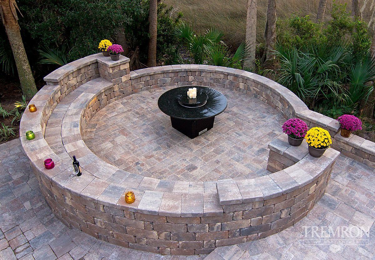 There is a fire pit in the middle of the patio.