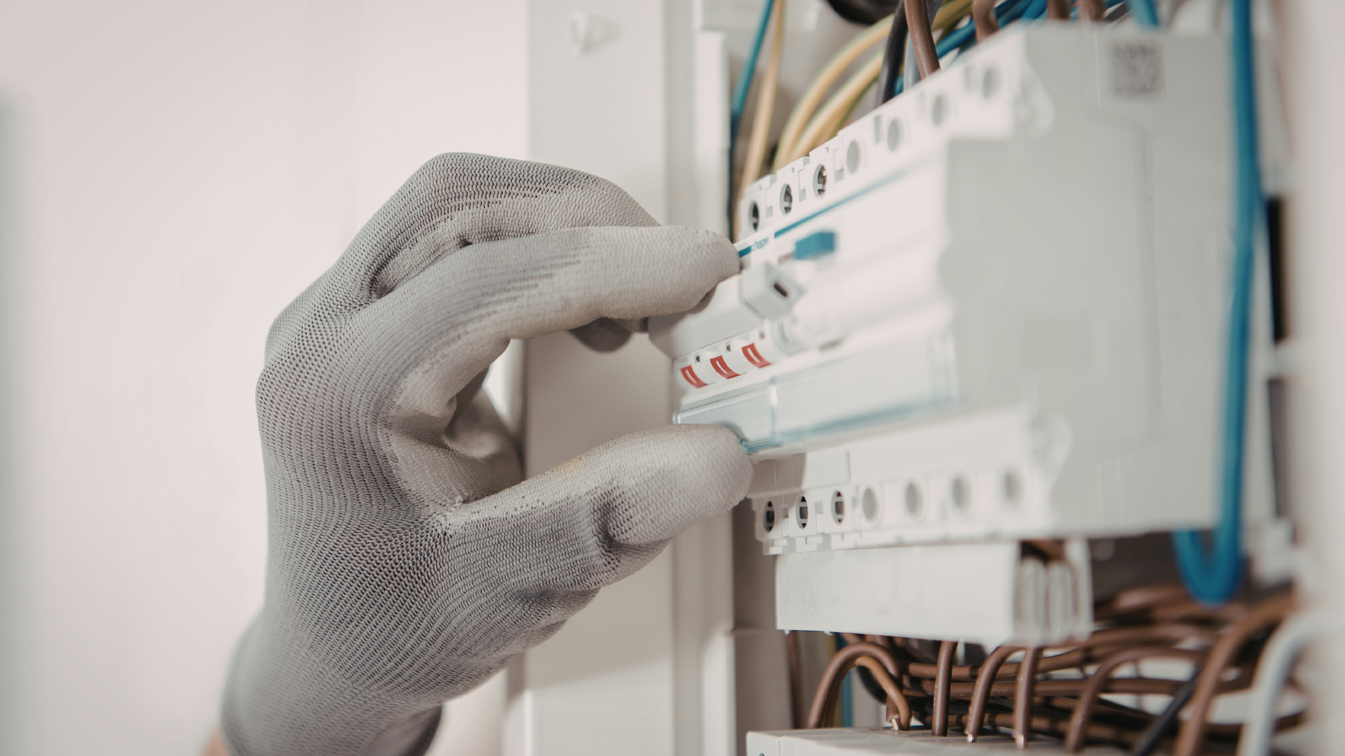 Close-up of flickering household lights and a person checking a breaker panel