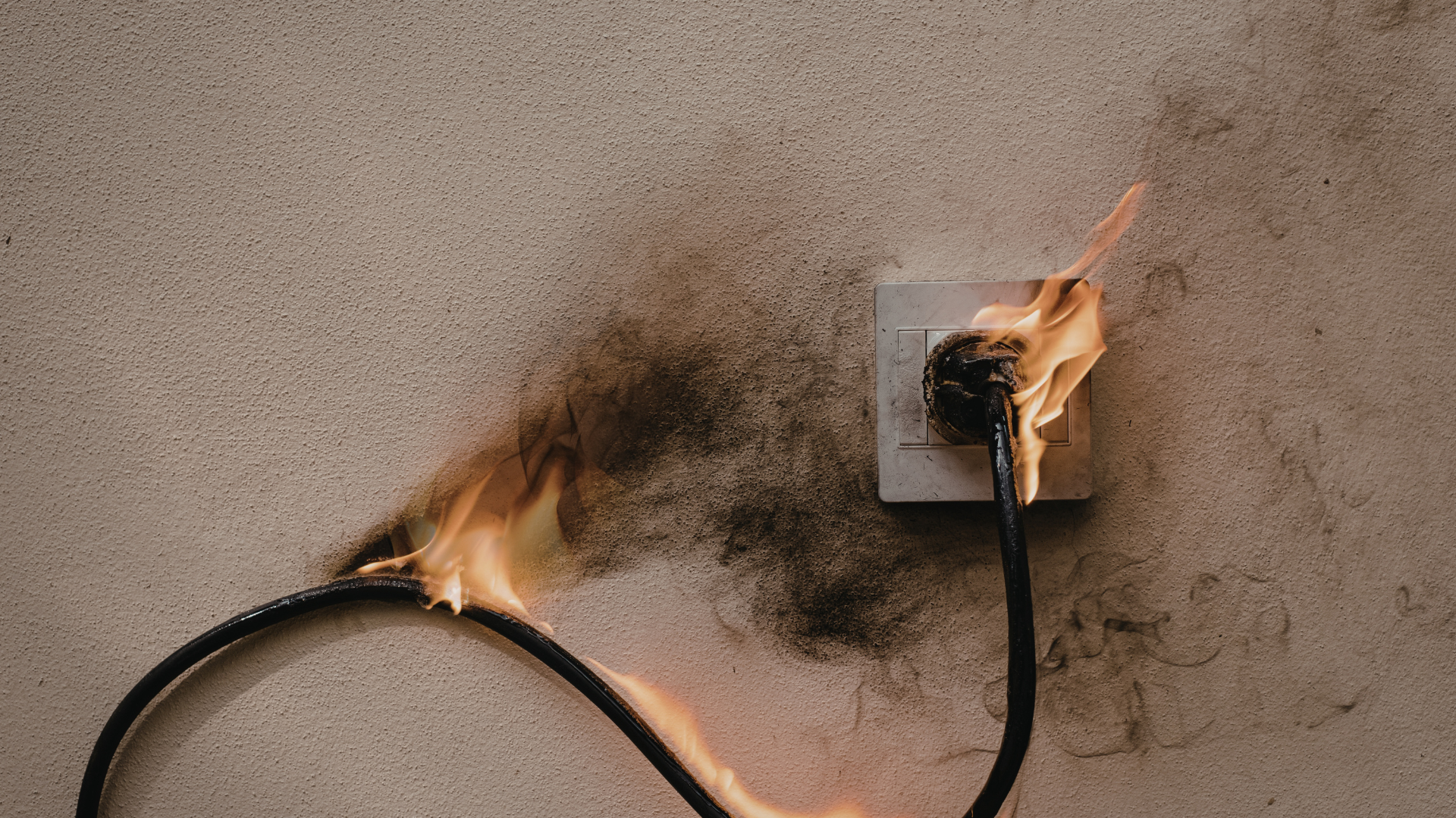 electrical fire risk damaged outlet smoke