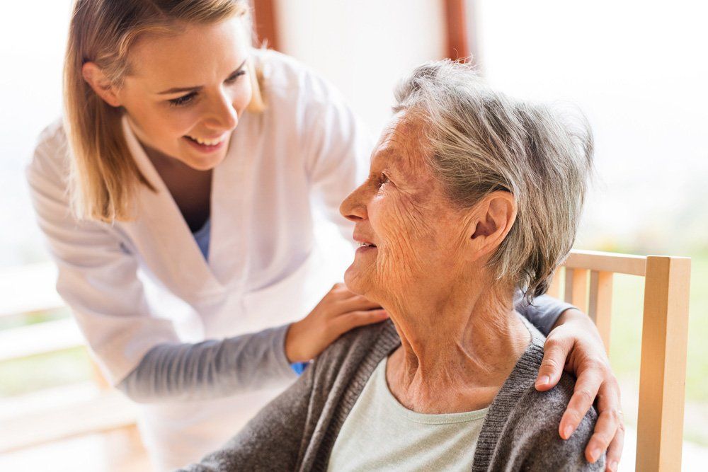 Health Visitor And A Senior Woman During Home Visit — PhysioCare Townsville In Thuringowa Central, QLD