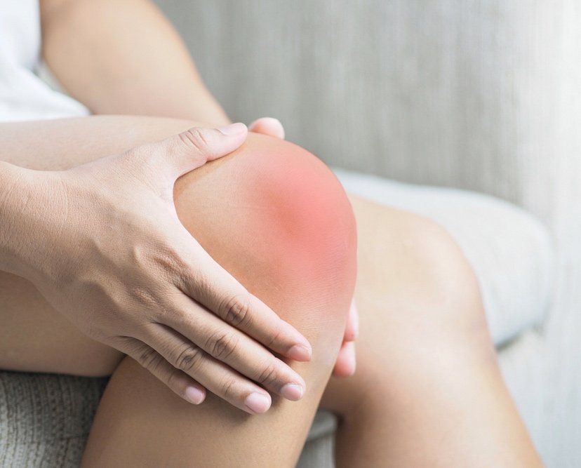 The Girl's Hand is Holding the Knee Pain Area — PhysioCare Townsville In Thuringowa Central, QLD