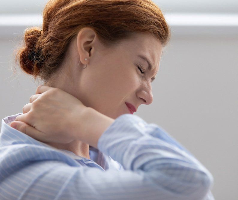 Woman Having Neck Pains — PhysioCare Townsville In Thuringowa Central, QLD