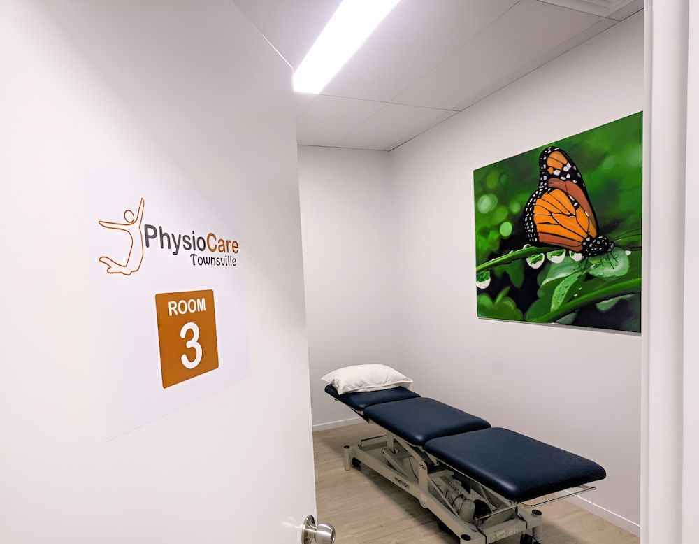 A Room With a Bed and a Picture of a Butterfly on the Wall — PhysioCare Townsville In Thuringowa Central, QLD