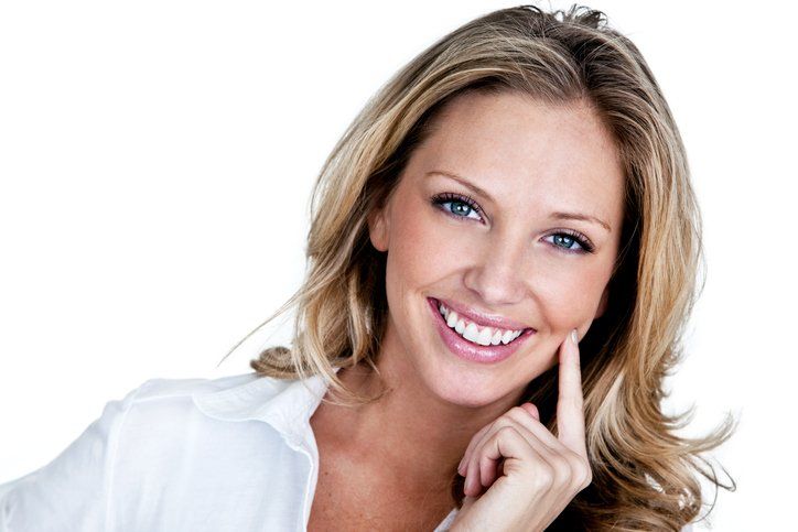 Woman Smiling — Eastpointe, MI — Universal Dental Center Woman Smiling — Eastpointe, MI — Universal Dental Center