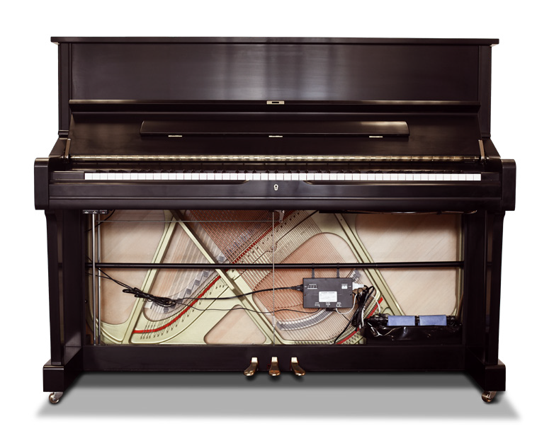 The inside of a piano with the keys visible