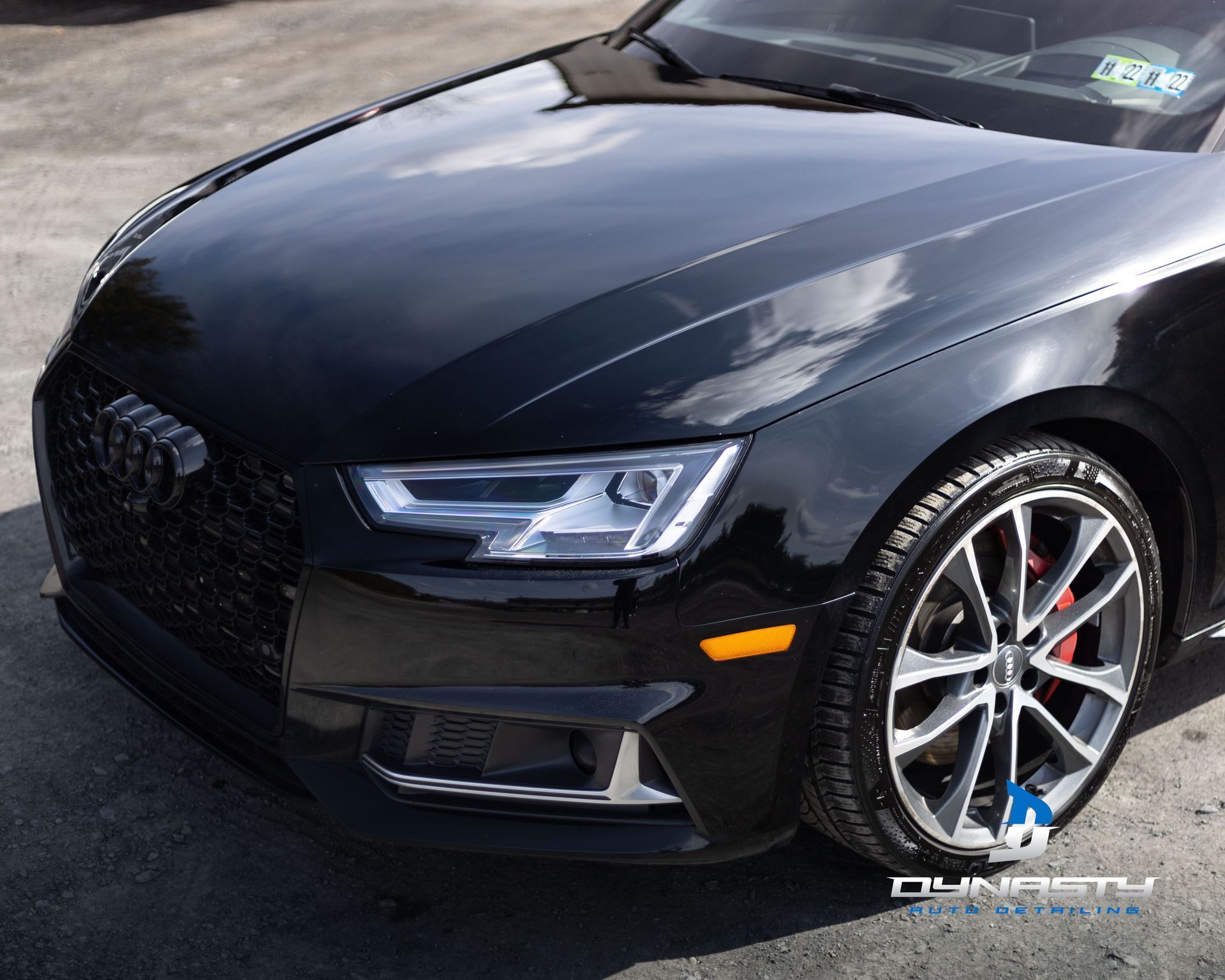 A black audi a4 is parked in a parking lot