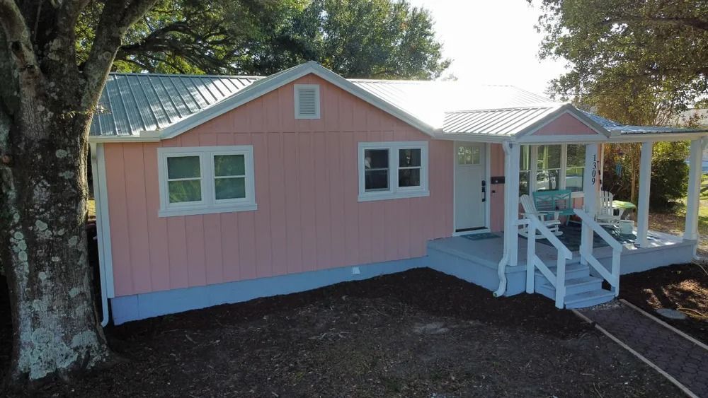 metal roof installed on a pink house in atlantic beach