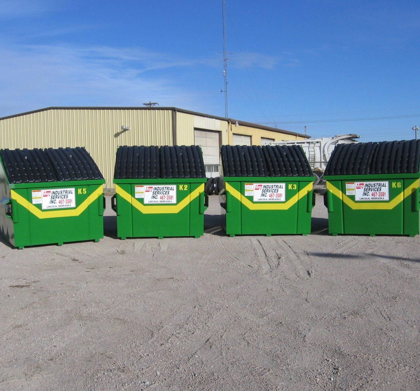 Four Commercial Dumpsters — Lincoln, NE — Industrial Services Inc. Four Commercial Dumpsters — Lincoln, NE — Industrial Services Inc.