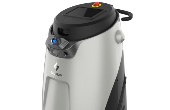 A white and black machine with a red button on the top
