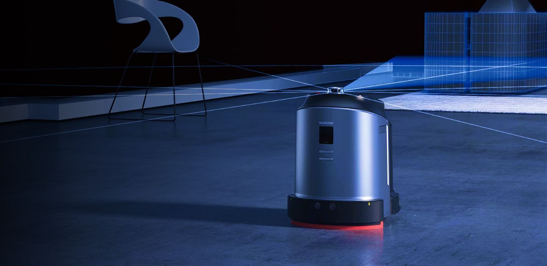A robot is standing on a concrete floor in a dark room.