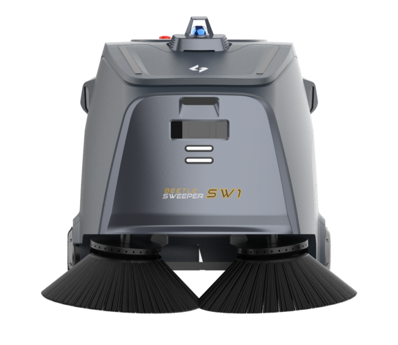 A robotic sweeper is sitting on a white surface