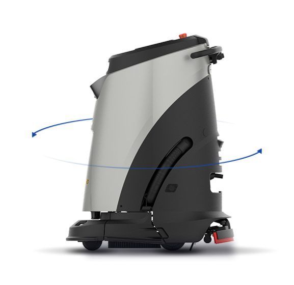 A robotic vacuum cleaner is sitting on a white surface.