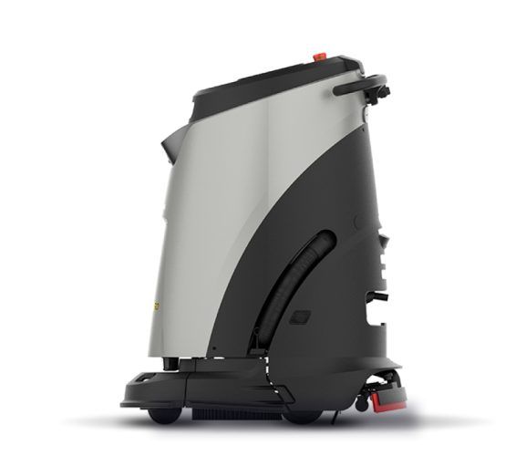 A robotic floor sweeper is sitting on a white surface.