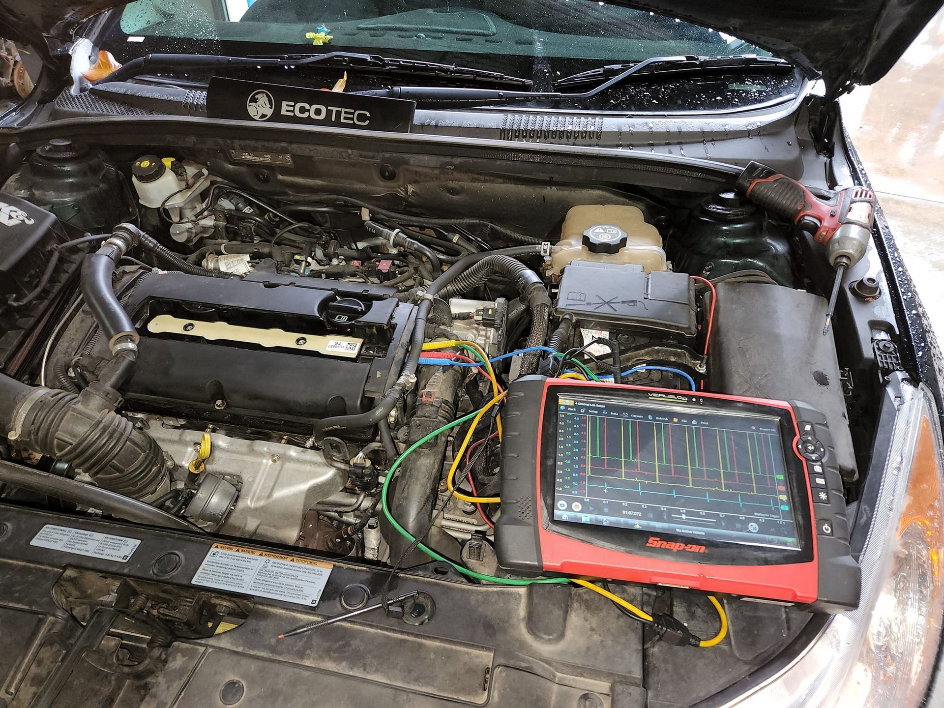 A Bunch of Wires Are Connected to A Hose — Genesis Automotive Services in Lavington, NSW