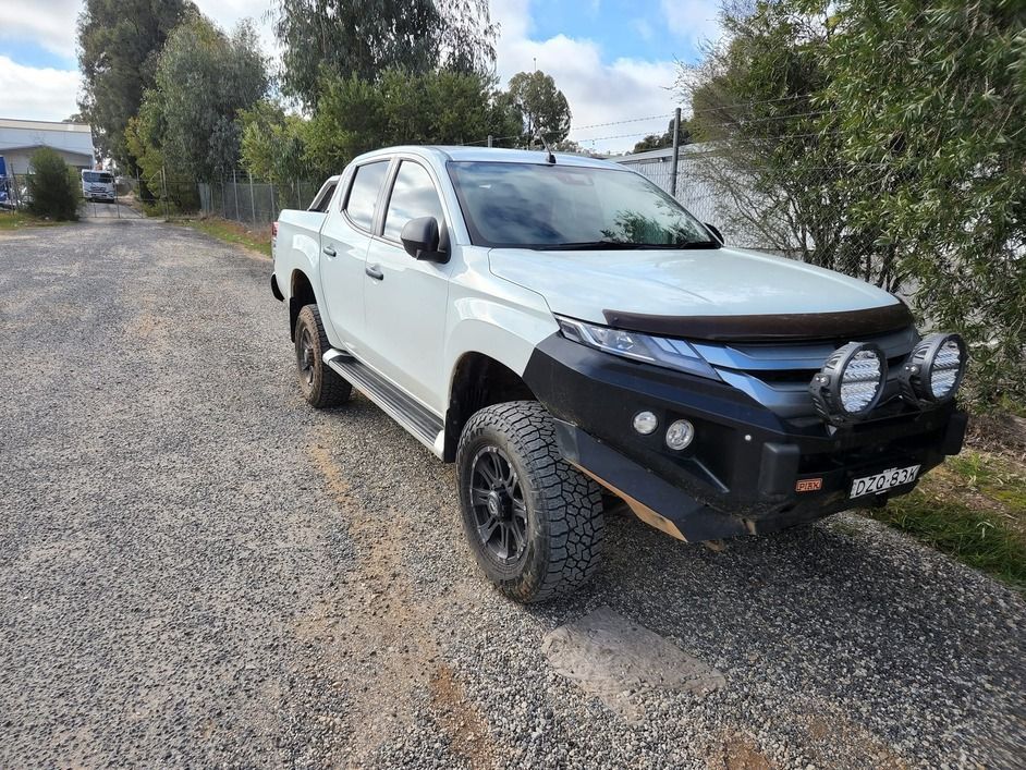 A Car with A Snorkel on The Hood Is Parked in A Garage — Genesis Automotive Services in Lavington, NSW