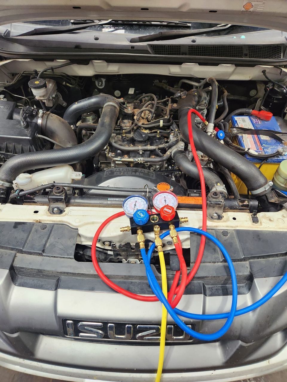 A Person Is Pressing the Auto Button on A Car Dashboard — Genesis Automotive Services in Lavington, NSW