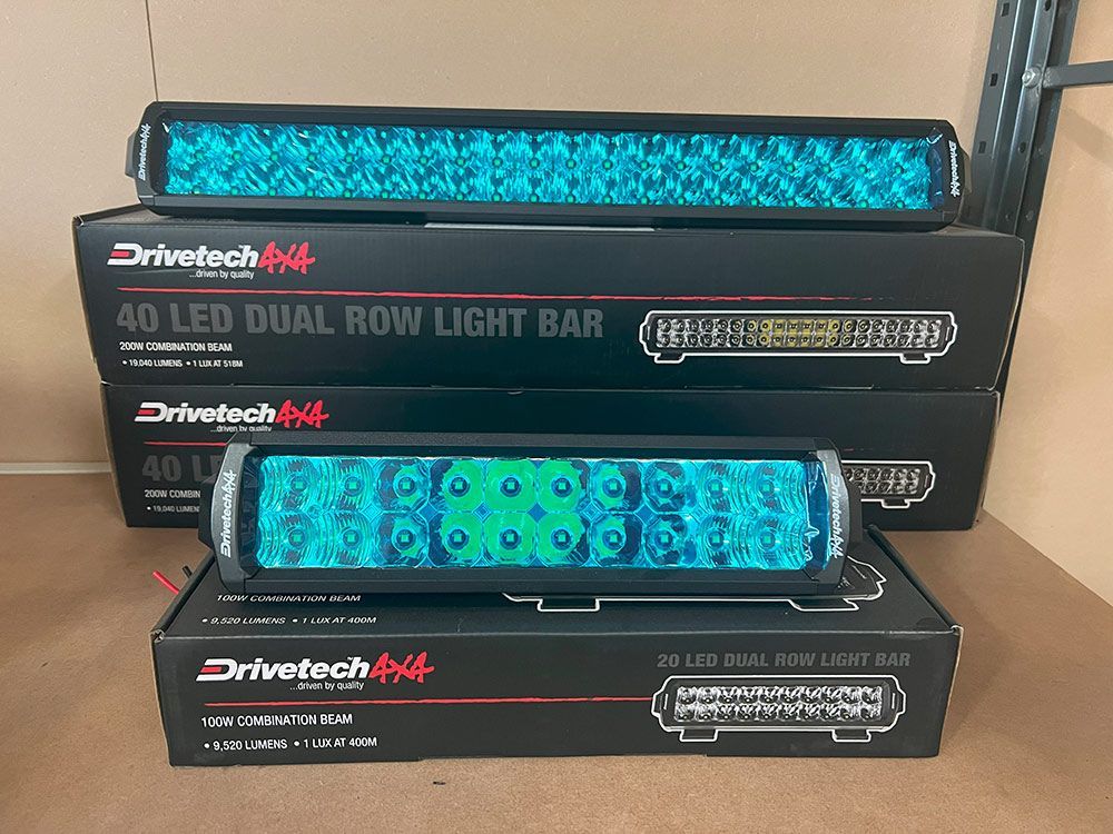 A Row of Led Dual Row Light Bars Are Stacked on Top of Each Other on A Table — Genesis Automotive Services in Lavington, NSW