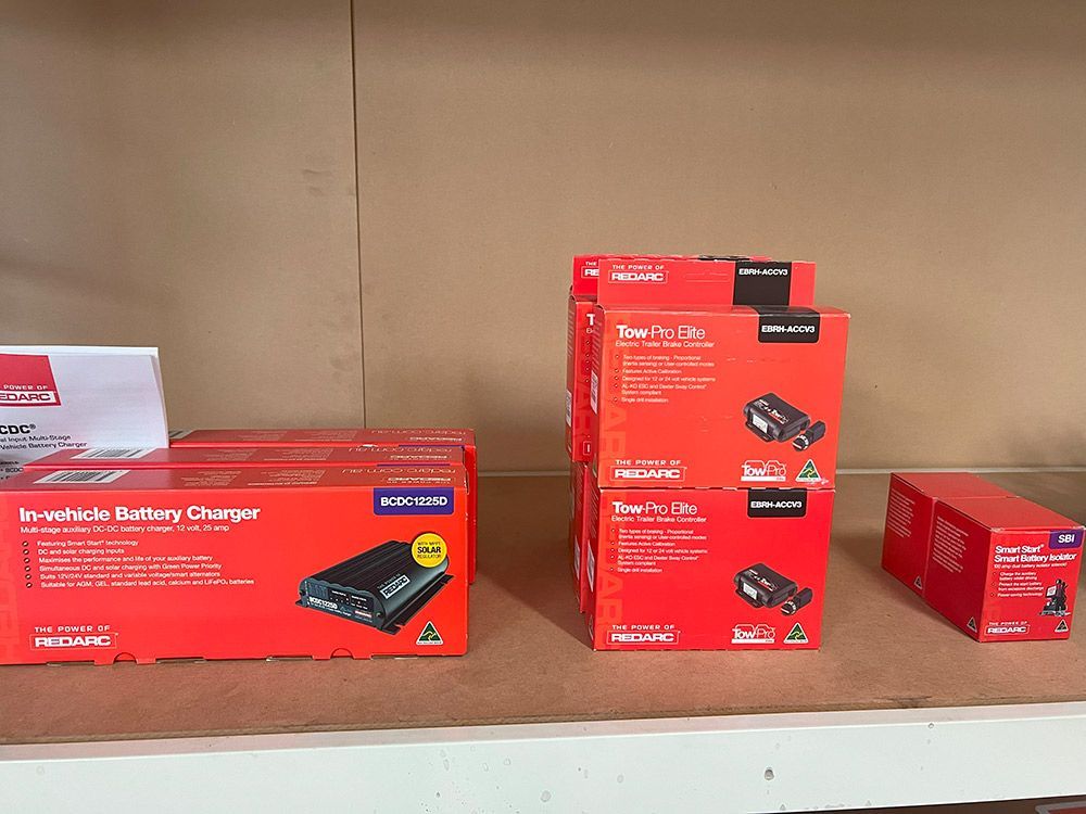 Several Red Boxes Are Stacked on Top of Each Other on A Shelf — Genesis Automotive Services in Lavington, NSW