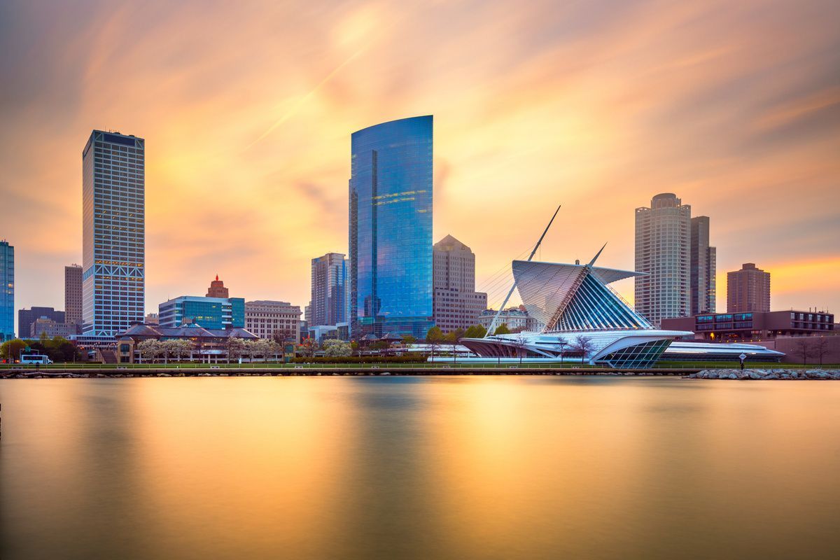 city skyline behind a body of water