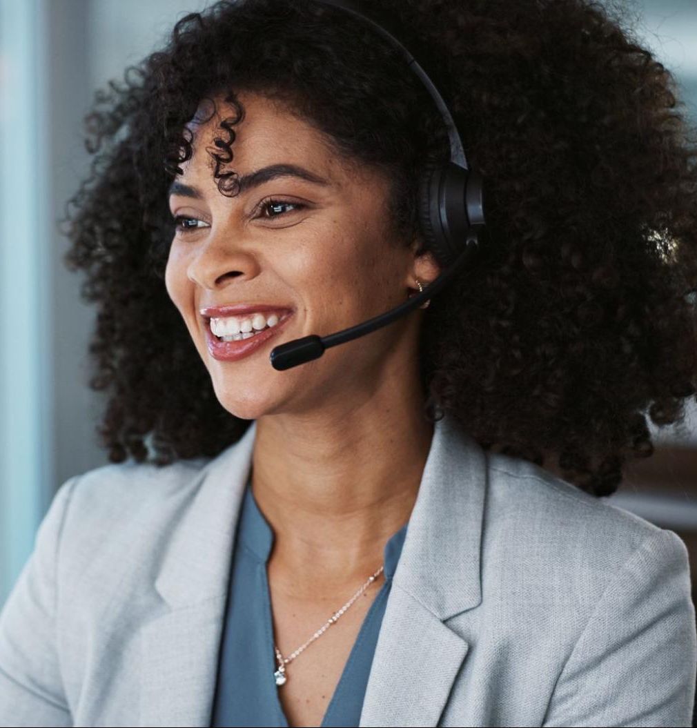 smiling woman talks on phone