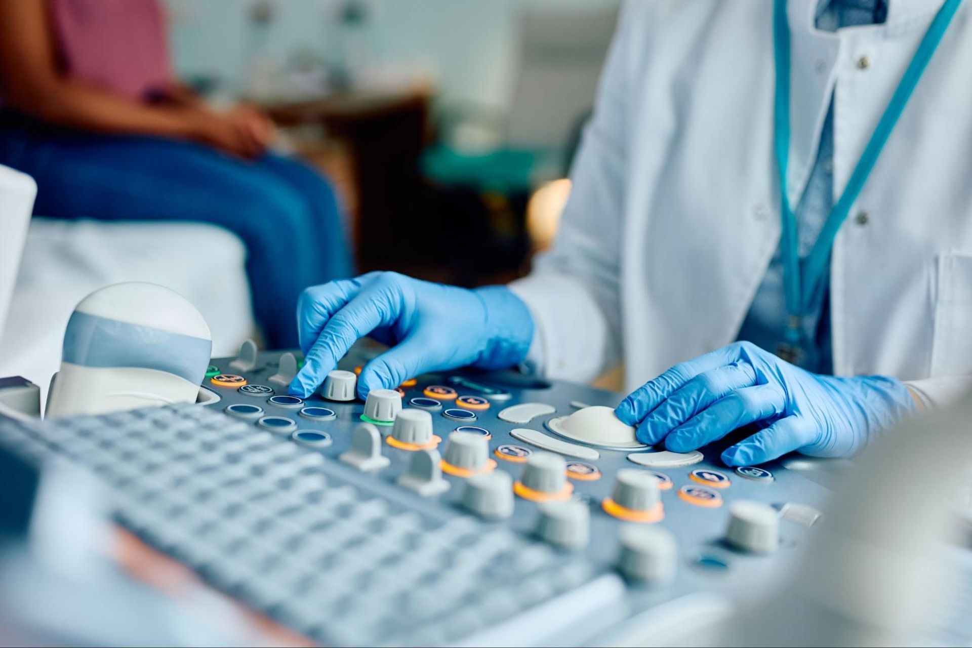 a medical technician using an ultrasound machine