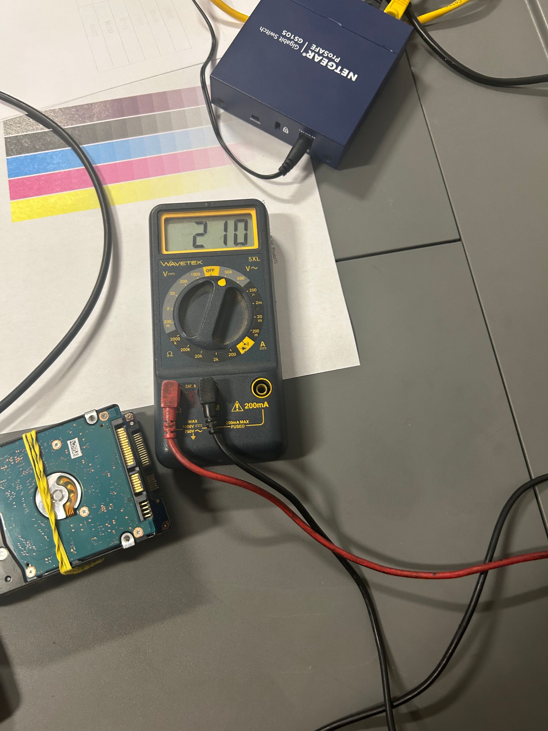 Technician checking printer model and toner part numbers for a DFW office