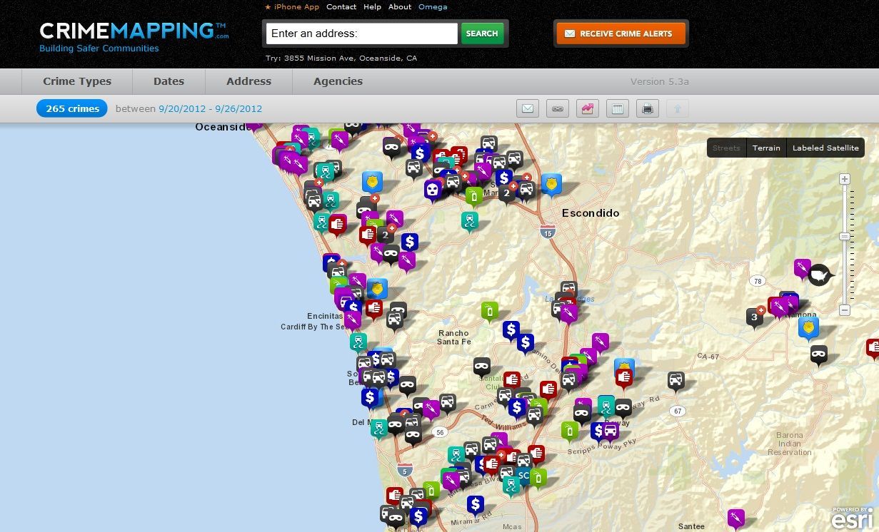 CrimeMapping map showing crime incidents marked with colored icons in a coastal and inland area.