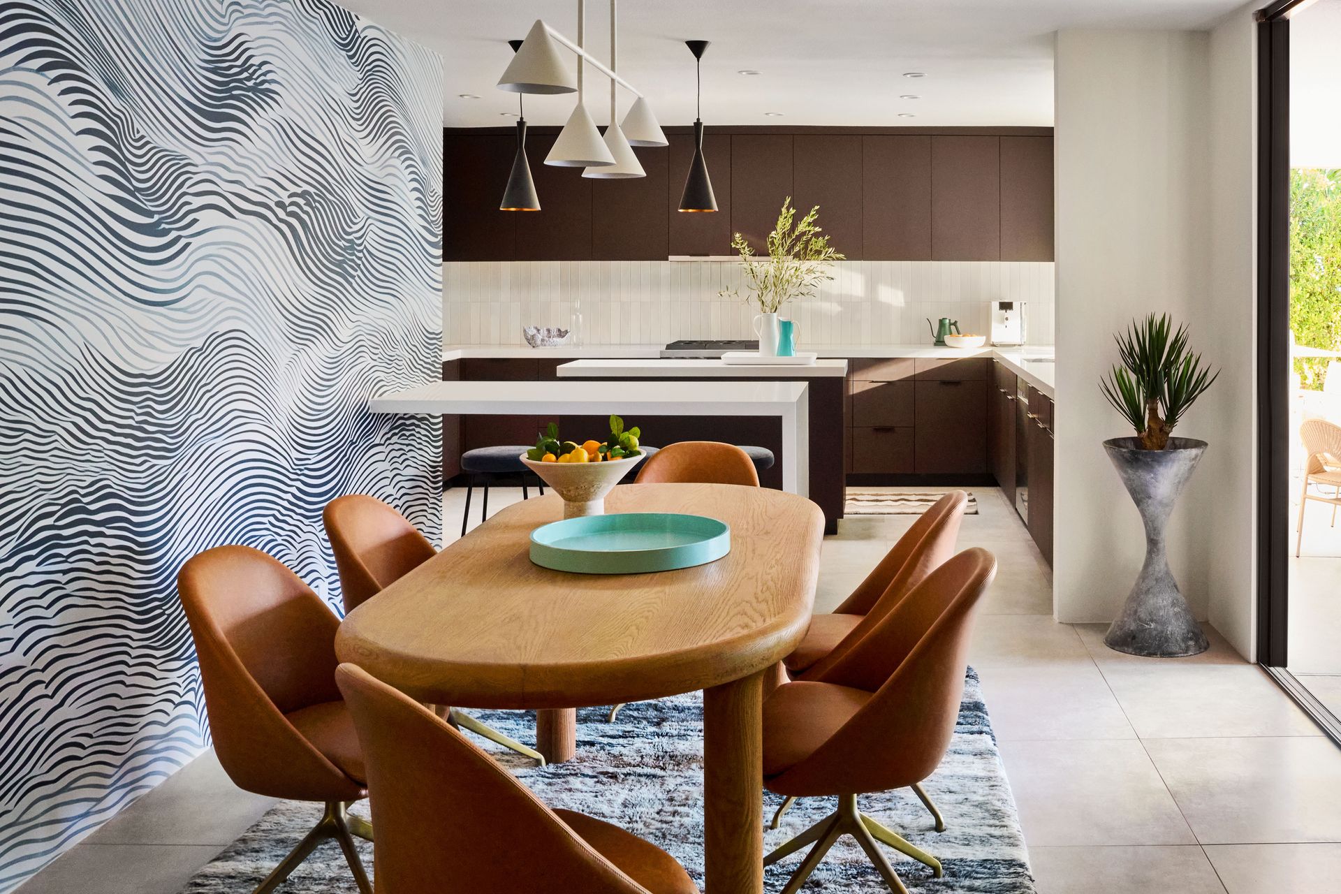 a kitchen with a large island and stools