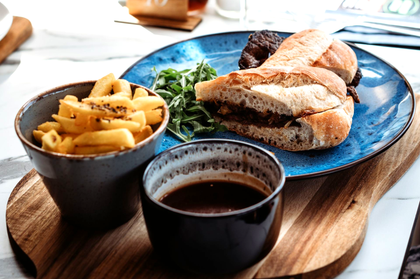 Weekday Lunch Menu - Riley's Steak Canadian, with caramelised onions, sea-salt & black pepper fries & dipping gravy
