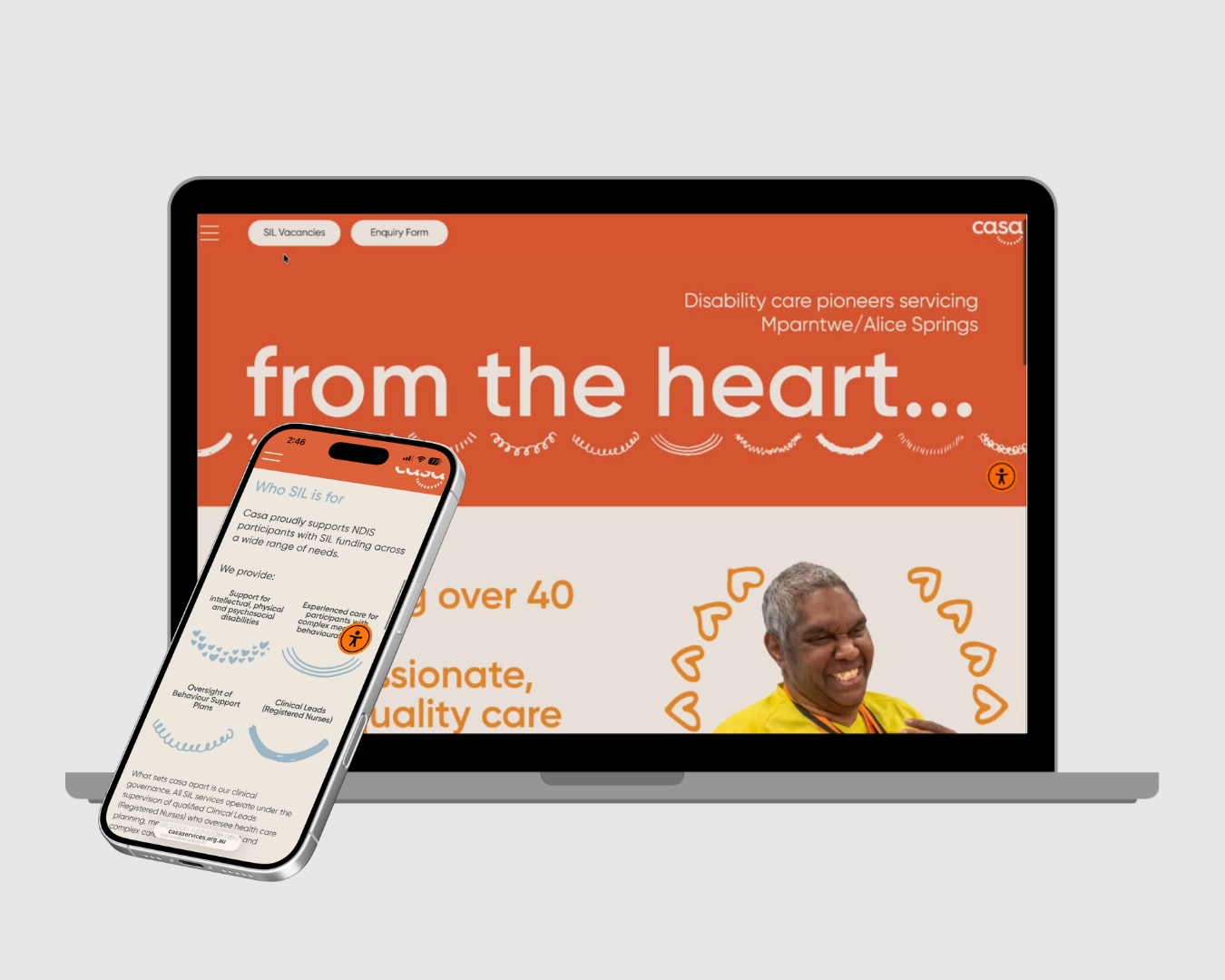 Laptop and phone displaying an orange healthcare website with the headline “from the heart…”